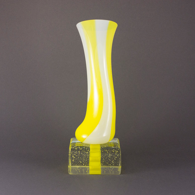 Yellow and White Vessel on Plinth