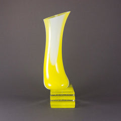 Yellow and White Vessel on Plinth
